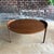 This circular Jens Risom table is a collectors dream. The walnut legs extend past the tabletop in a tray style design, and...