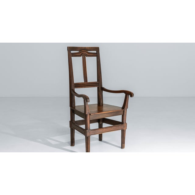This 19th century French Neoclassical walnut armchair reflects the restrained elegance and architectural clarity of the...
