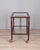 Food trolley with wooden structure and two transparent glass shelves, with gilded brass handle, Italian design, 1960s.