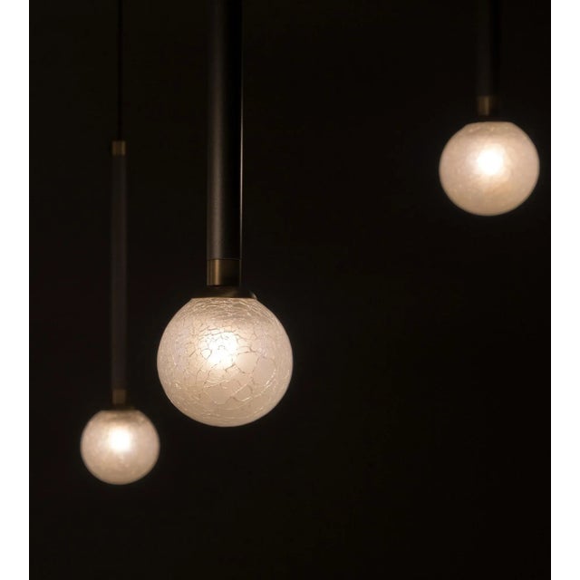 Crystal ball pendant light, six lights, by morica design dimensions: d 8 x h 36 cm (each light) materials: hand-blown...