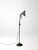 This early 20th century industrial task lamp features a cast iron base, adjustable gooseneck arm, spun metal shade, and...