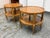 Design Plus Gallery presents a Pair of Mid 20th Century Two-Tiered Side Tables. This matching pair showcases round tops...