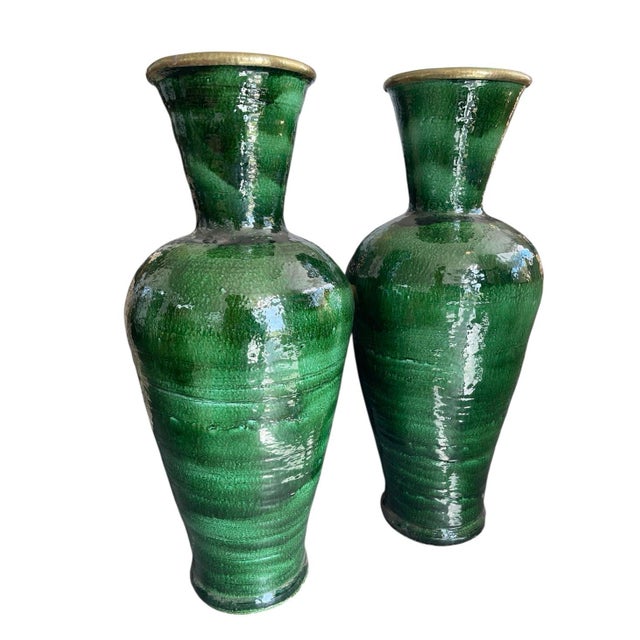 A commanding pair of monumental terracotta floor vases, recently hand-crafted by master artisans in Marrakech, Morocco....