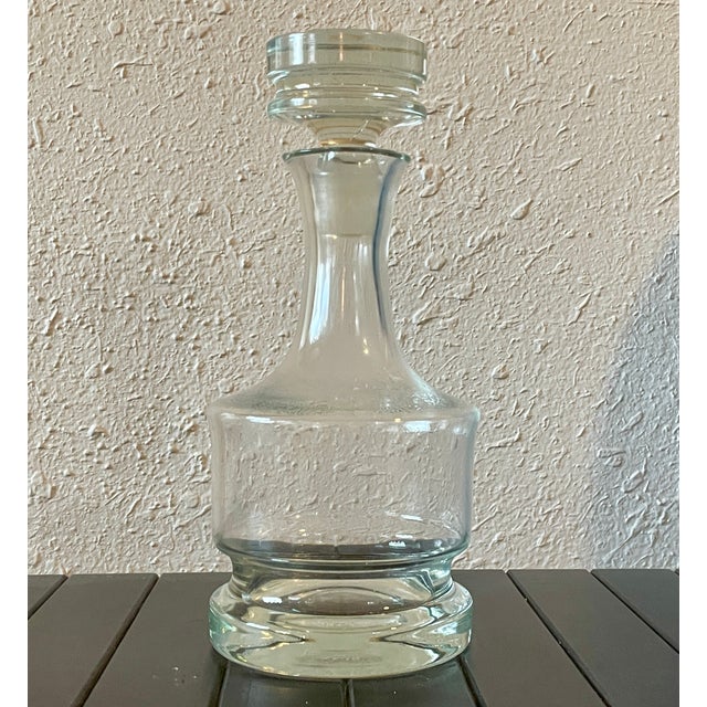 This striking "Margit" decanter is a quintessential example of mid-century Danish glasswork by Svend Jensen. While no...