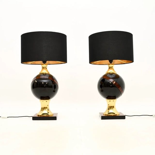 A very large and stylish pair of vintage Italian walnut and brass table lamps, dating from around the 1970’s. They are...