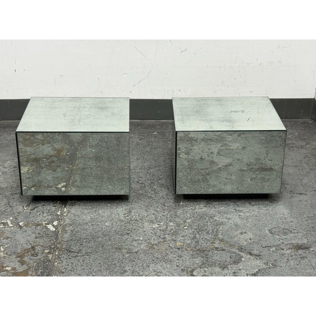 Design Plus Gallery presents a Pair of Mirrored Plinth Side Tables. Each table is composed of mirrored panels with a...