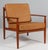 Grete Jalk lounge chair in teak. New upholstered cushions with full grain aniline leather. Made by France & Daverkosen....