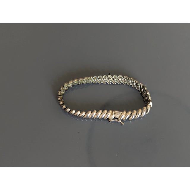 It appears to be signed ZB. This is a silver bracelet unmarked or a worn off stamp.