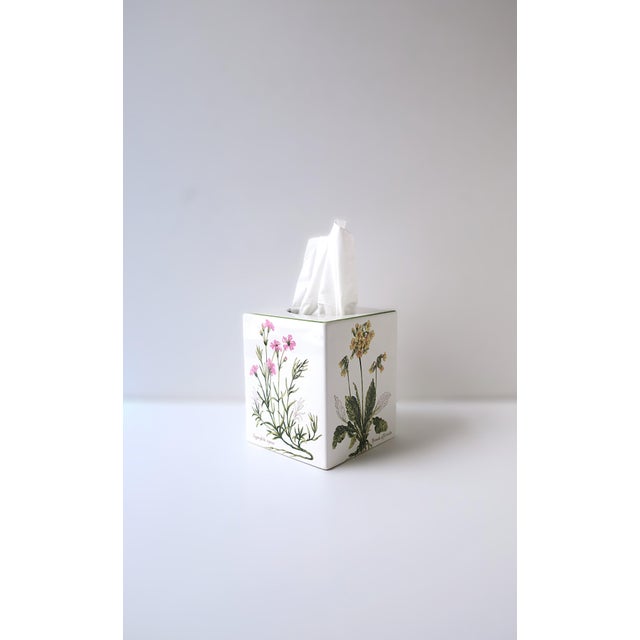 A porcelain tissue box holder cover with botanical design, circa late-20th century, Portugal. A white porcelain tissue box...