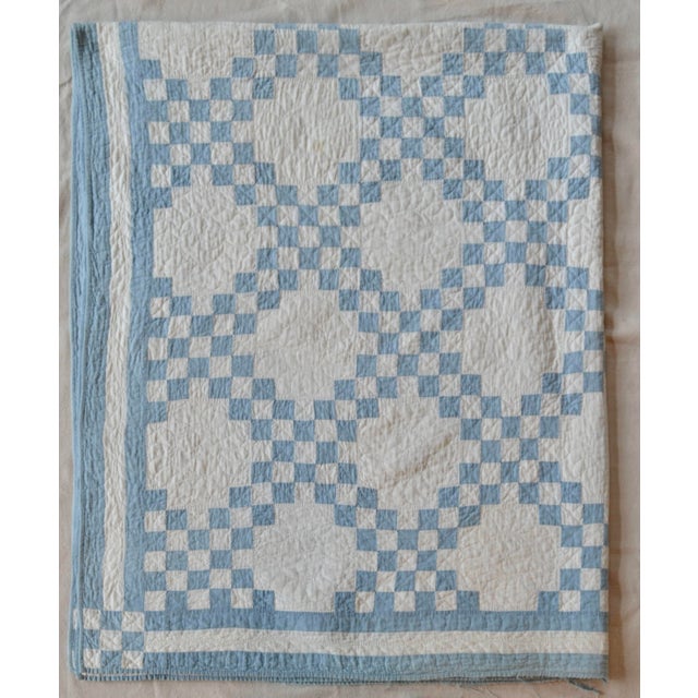 Beautifully hand-stitched and hand-quilted summer-weight quilt in a soft denim blue and ivory. The detail is stunning....