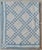 Beautifully hand-stitched and hand-quilted summer-weight quilt in a soft denim blue and ivory. The detail is stunning....