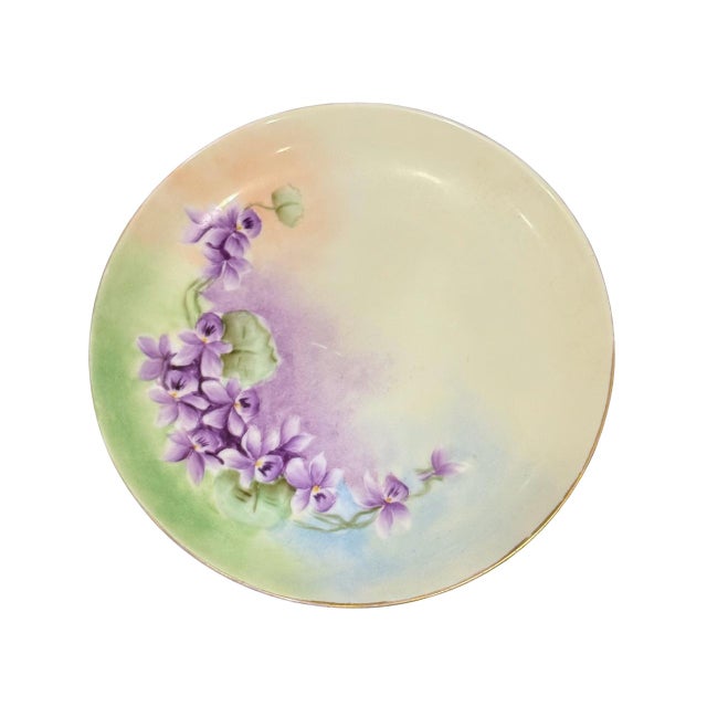 A romantic collection of six early 20th century porcelain plates in soft pastel florals. Every plate features floral...
