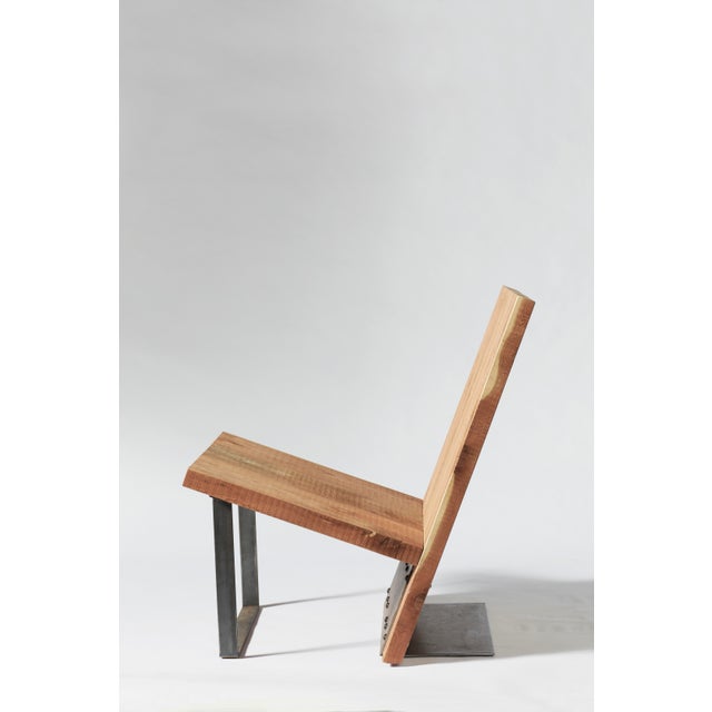 Modern, streamlined angles formed from a single piece of bent steel. A chunky cedar plank frame is perfectly pitched for...