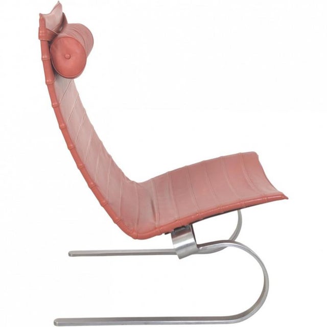 Poul Kjærholm PK20 chair upholstered in original red leather, and with a frame of brushed spring steel. The chair is from...