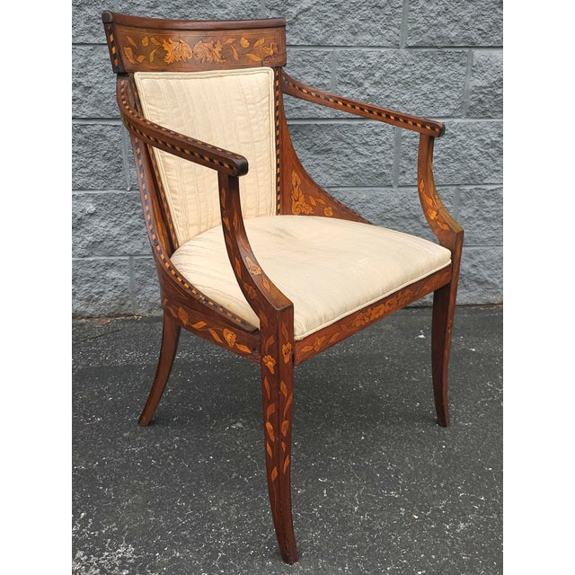 An 18th Century Neoclassical Dutch Marquetry Satinwood inlays And Upholstered Armchair. Frame in good antique condition....