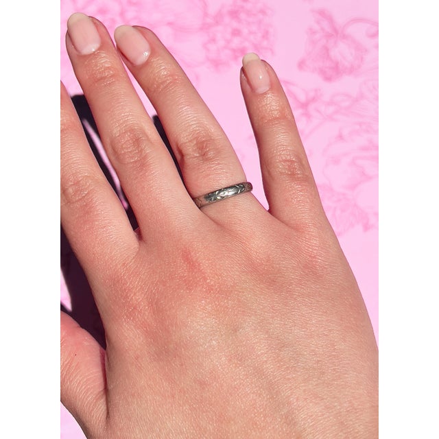 About This Ring: This classic, romantic platinum wedding band is sure to take your breath away! The band is not just any...