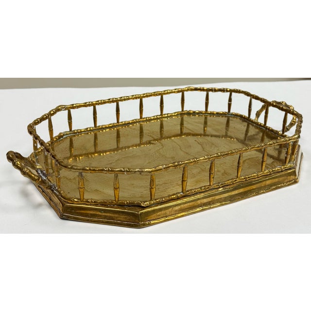 Vintage angular brass tray with faux bamboo design rail and handles. Great as a bar tray, vanity tray or to hold your...