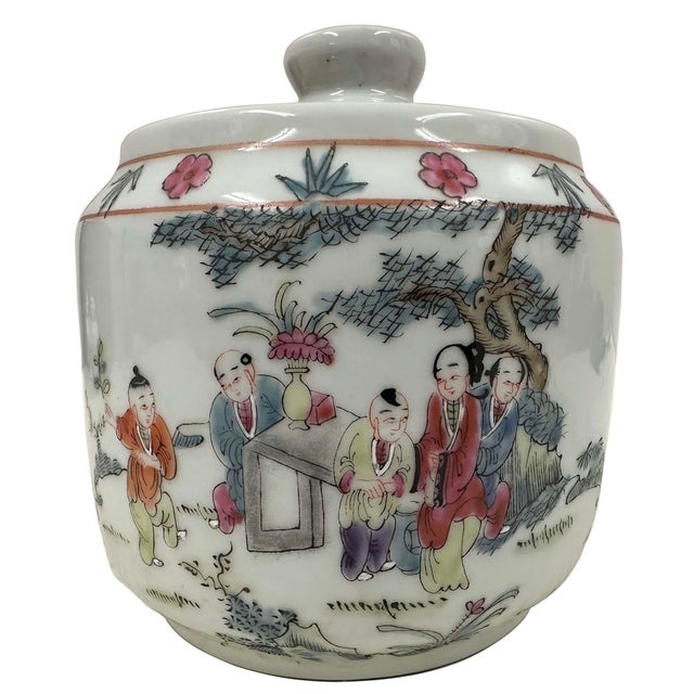 This Chinese export porcelain ginger jar decorated in the famille rose palette. It depict scenes of figures, children...