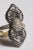 An extraordinary cocktail ring featuring a double petal flower motif, or maybe a bow, comprised of round, brilliant cut...