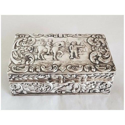A fine antique Dutch silver rectangular trinket box, richly decorated with hand-chased repoussé work and displaying the...