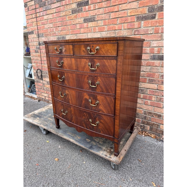 Antique Edwardian Mahogany Bow Front Tall Boy Chest of Drawers and dating from around 1900. Constructed from quality...