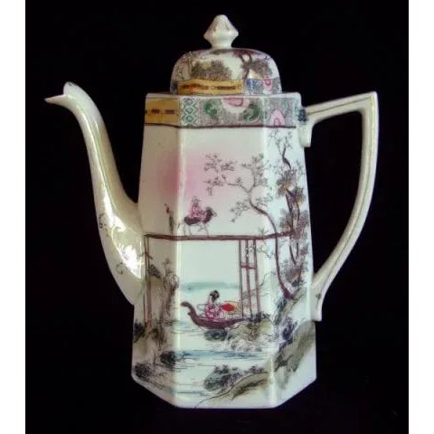 This Japanese Meiji period 6 sided porcelain chocolate pot was made for export to the Western markets. The teapot has a...
