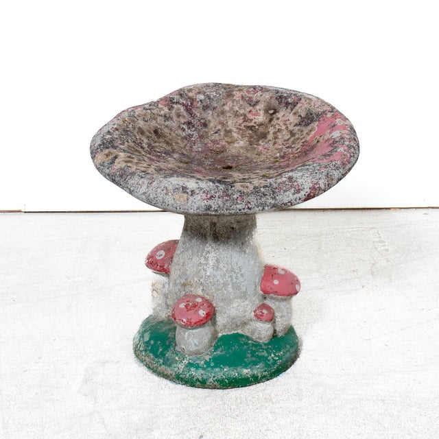 Whimsical and wonderfully weathered, this mid-20th century French garden seat takes the playful form of an oversized...