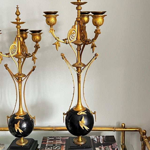 How lovely is this pair of antique gilt bronze and marble candelabra!? They have all of the Hallmarks of the Empire style...
