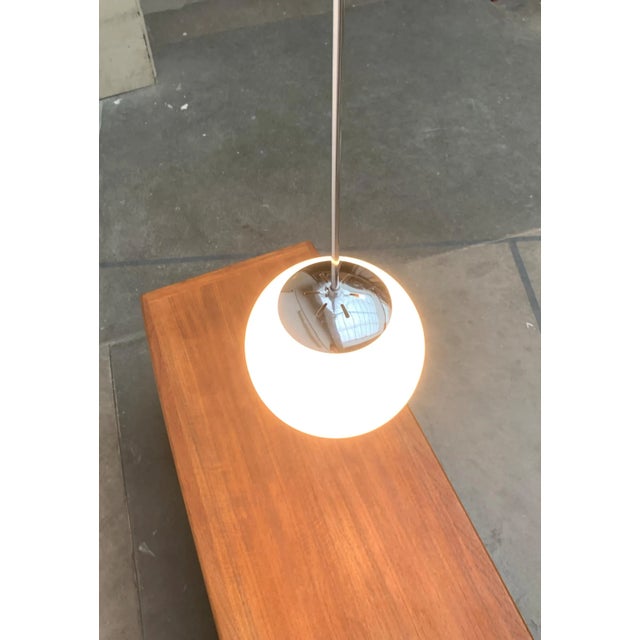Simple Mid Century Glass Ball Pendant Light. Classic pipe pendulum with ball. Perfect for the old building ceiling. The...