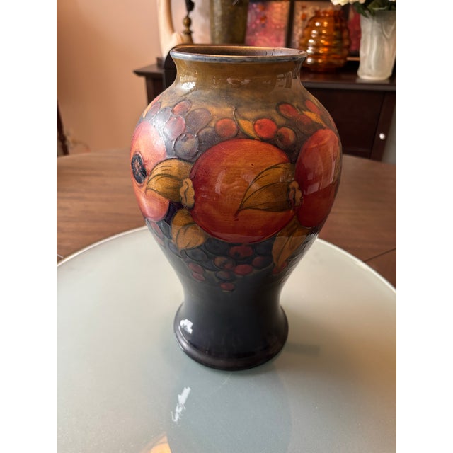 Moorcroft Pomegranate Vase circa 1913 to 1928 is marked as “Made In England”, and is in superb condition with no chips...