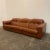 Mid-century modern reclining leather sofa. Each section reclines. Upholstered in brown leather with some wear to the seats...