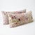 An extra-long lumbar pillow cover set made from hand-embroidered Uzbek Suzani cotton — hand-embroidered pink blossoms,...