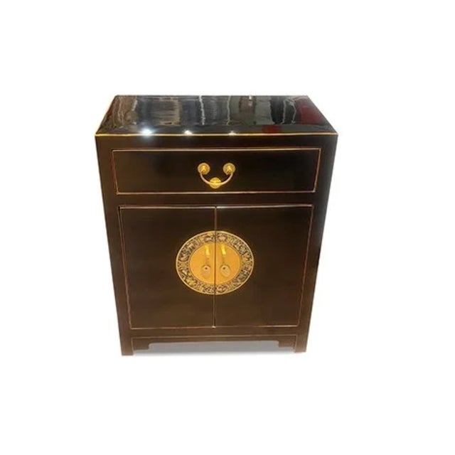 Zodiac Hardware Lacquer Side Table is made out of elm wood. It has 1 drawers, 2 doors, and 1 removable shelf. It is very...