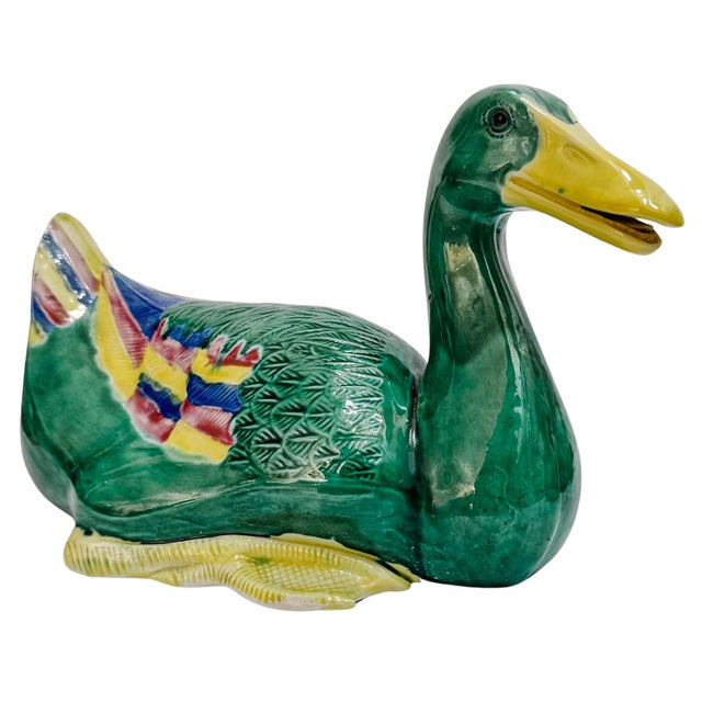Striking pair of mid 20th century Chinese ceramic duck figurines rendered in a rich, high-gloss emerald green glaze and...