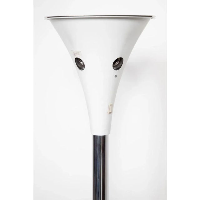 Vintage 1970s chrome floor lamp of german design. The lamp has a floor switch with a dimmer, but also two switches under...