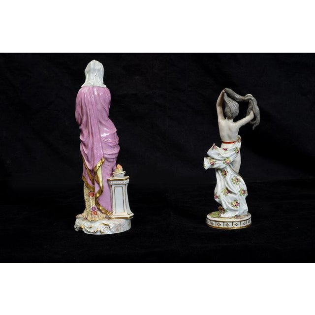 A pair of polychrome Meissen porcelain sculptures depicting scenes of women from the late 19th century. Both sculptures...