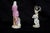 A pair of polychrome Meissen porcelain sculptures depicting scenes of women from the late 19th century. Both sculptures...