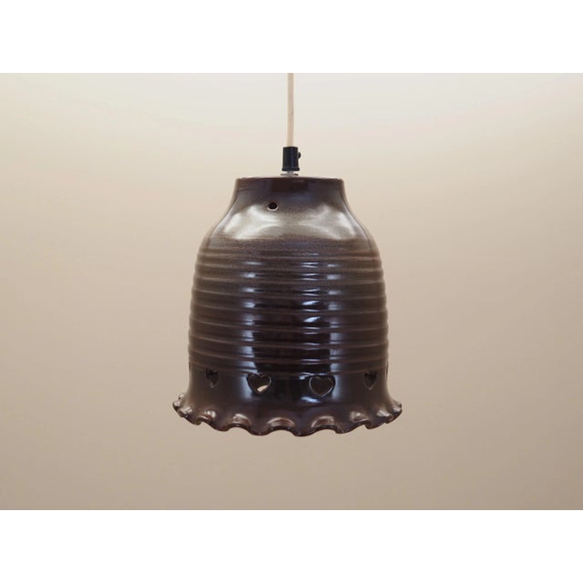 The lamp was made in the 1960s, Danish production. Made of ceramic. The unique construction is not only a design element,...