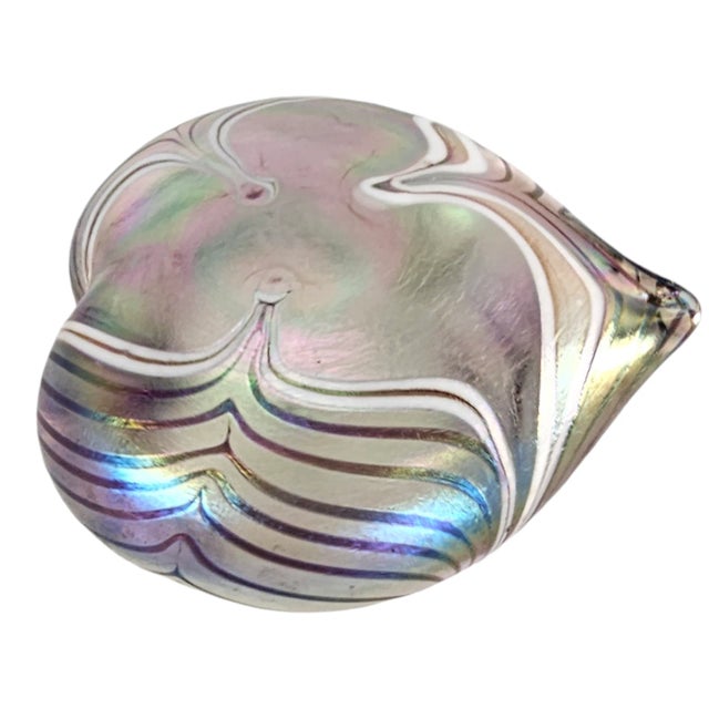 This vintage blown art glass paperweight features a unique pulled feather pattern on aurene glass. The controlled feather...