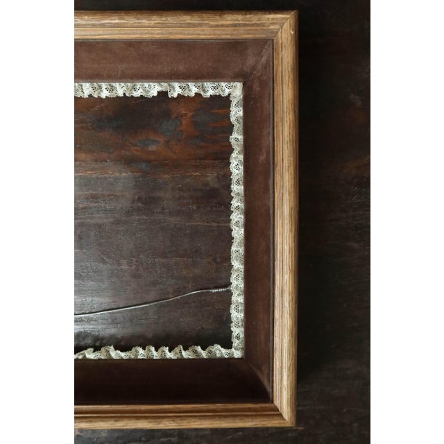 Velvet and lace suggest a Victorian or Edwardian aesthetic often associated with late 19th and early 29th century designs....