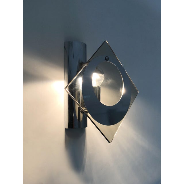 Pair of chrome-plated metal and glass wall sconces, veca fontana arte style. 1970s beautiful italian wall sconce in the...