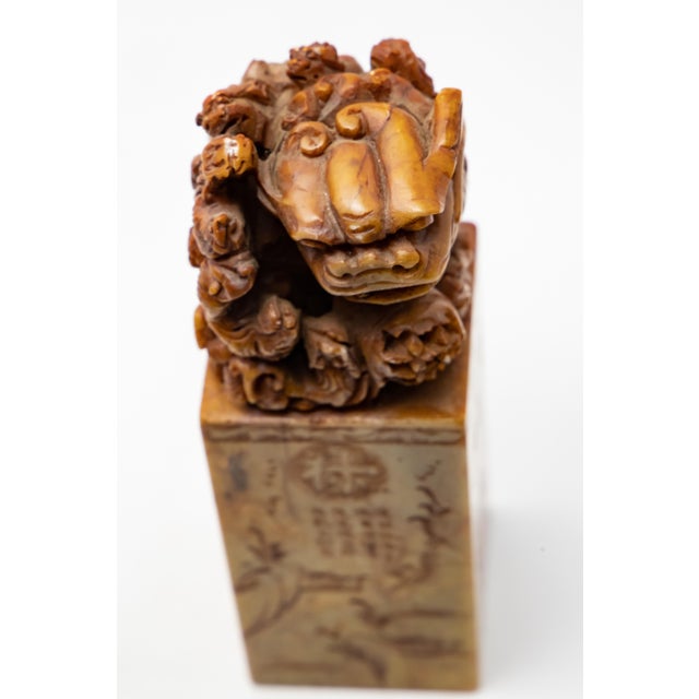 Offering a Chinese hand carved chop seal. This one depicts a Foo Dog on top guarding a bunch of little ones. The sides are...