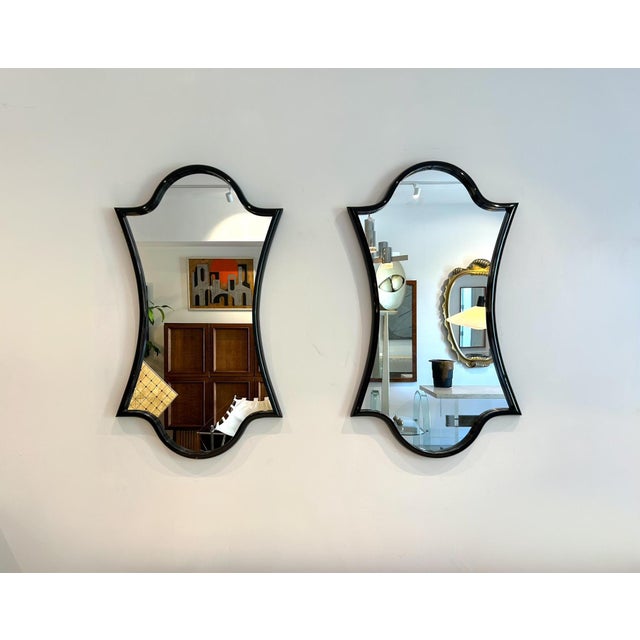 Pair of modern wall mirrors with frames in a black gloss lacquered finish. Nice size and scale. Can be refinished to a...