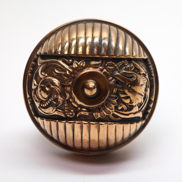 This Italian Renaissance style asymmetrical polished bronze entry door knobs were made by Reading in the 1890 catalog. It...