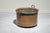 Large antique copper cauldron with two handles used as a kitchen utensil. The copper is in its original condition with...