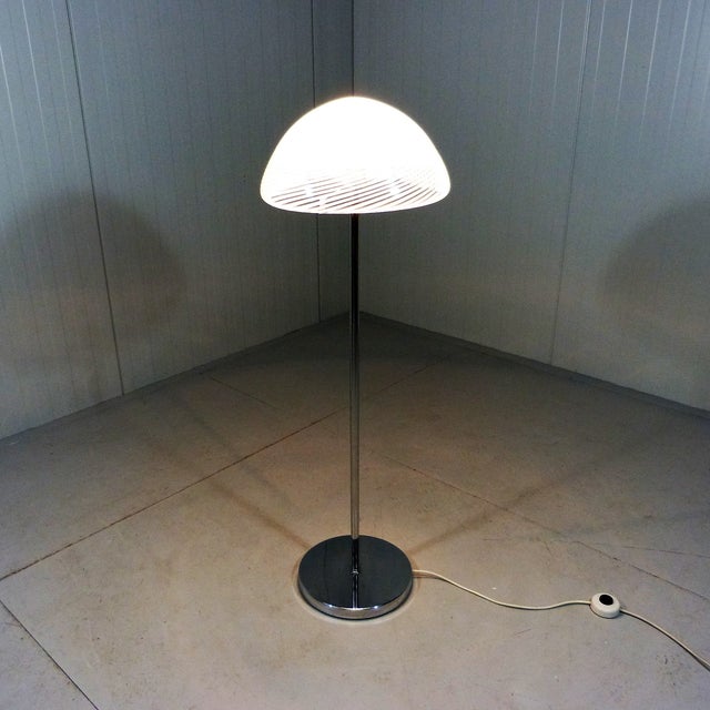 Floor lamp LT 350 by Carlo Naso for Mazzega, Italy. Chrome plated stand and shade holder, white glass shade with a striped...