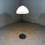 Floor lamp LT 350 by Carlo Naso for Mazzega, Italy. Chrome plated stand and shade holder, white glass shade with a striped...