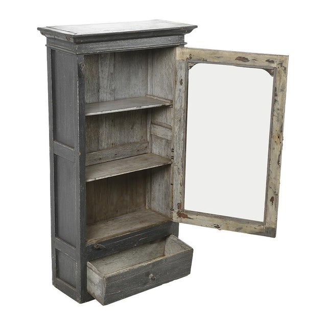 This weathered wooden wall display case is an authentic and functional piece, perfect for adding character to your...