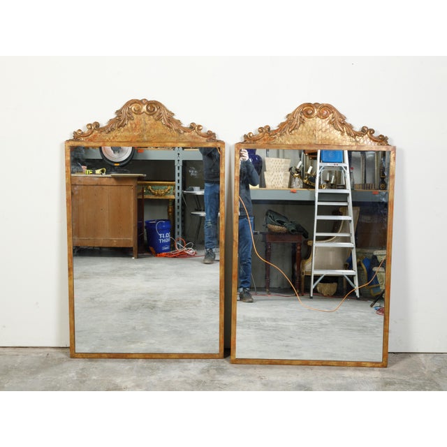 A pair of carved giltwood architectural fragments from the 19th century, mounted on custom gilt metal frames. This pair of...