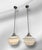 These charming pendant light are subtly reminiscent of the Neoclassical style! The caps, canopies, and chains show a deep...
